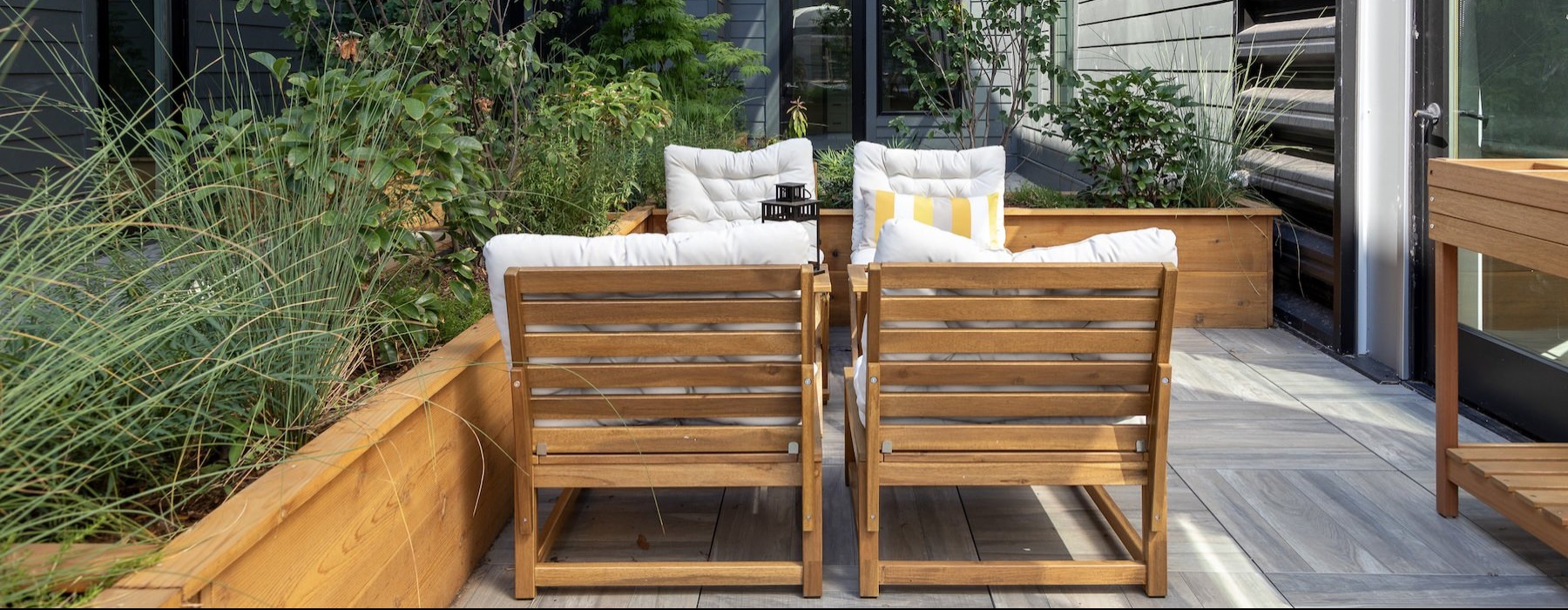 a deck with chairs and a table