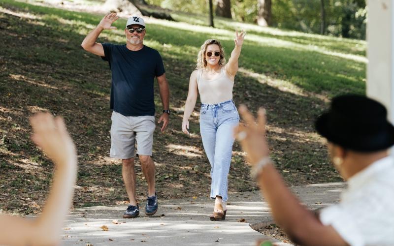 a group of people on a park path