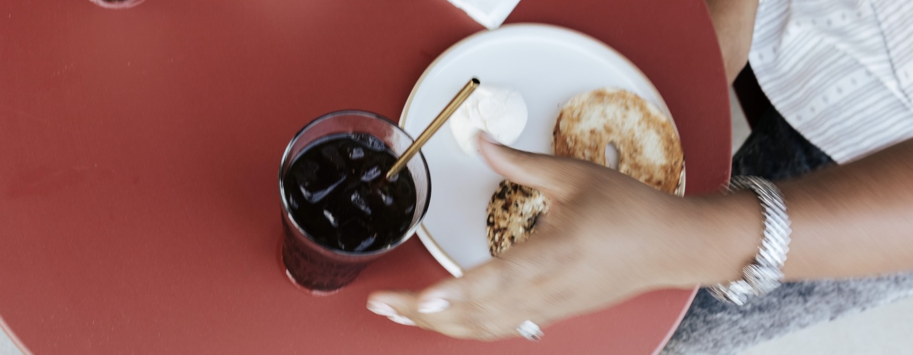 a hand holding a plate with food